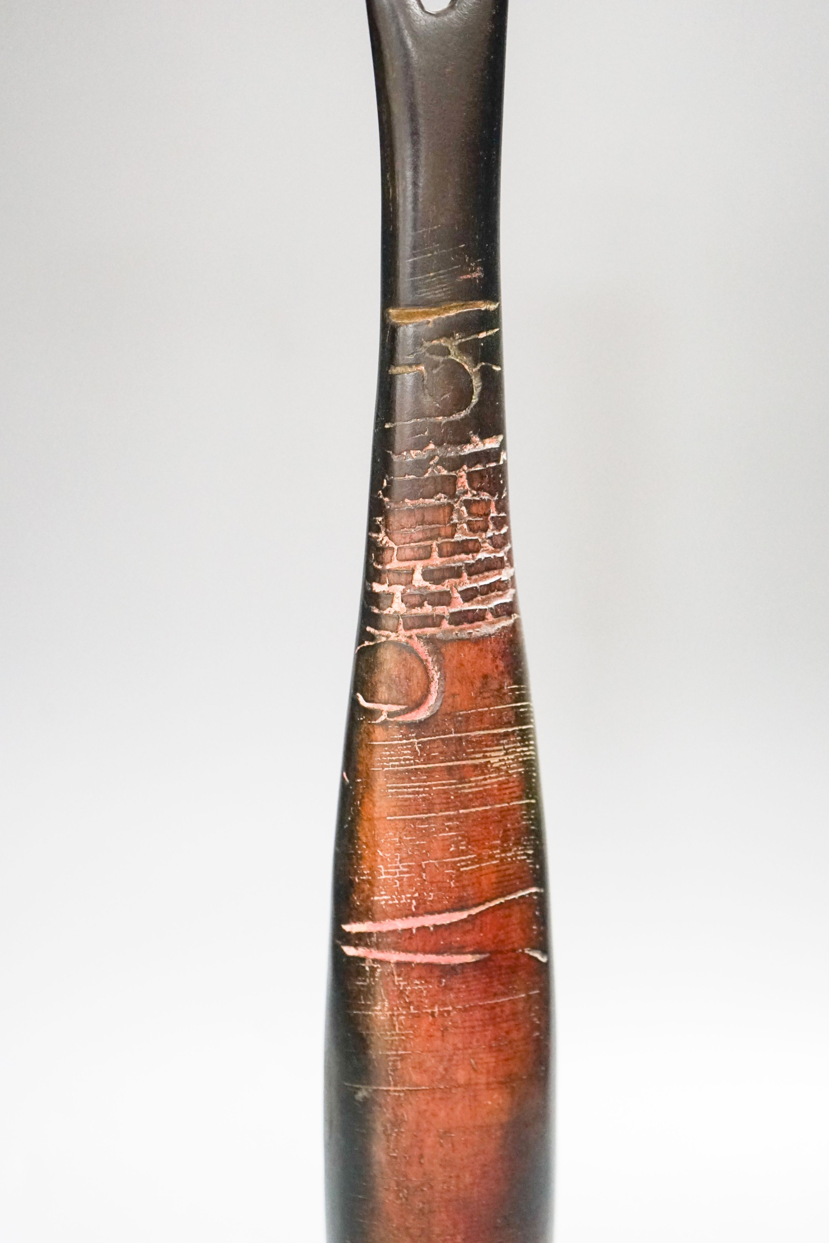 Peter Hayes (b.1946), a brown burnished raku ‘standing stone' sculpture, on a slate plinth 38cm